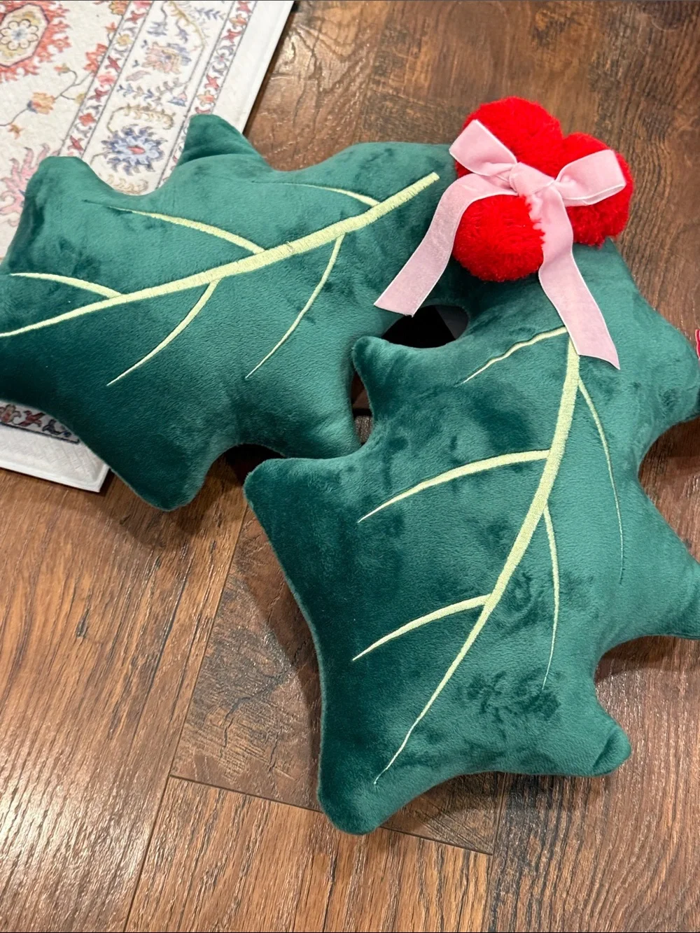 Green Holly Leaf Throw Pillow Pair with Red Pom Accents